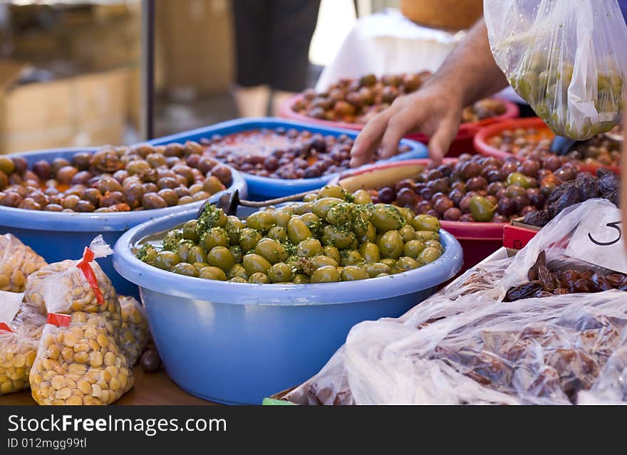 Spanish olives on red hot chili pepper sauce and green mojo. Spanish olives on red hot chili pepper sauce and green mojo