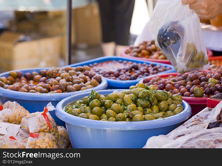 Spanish olives on red hot chili pepper sauce and green mojo. Spanish olives on red hot chili pepper sauce and green mojo