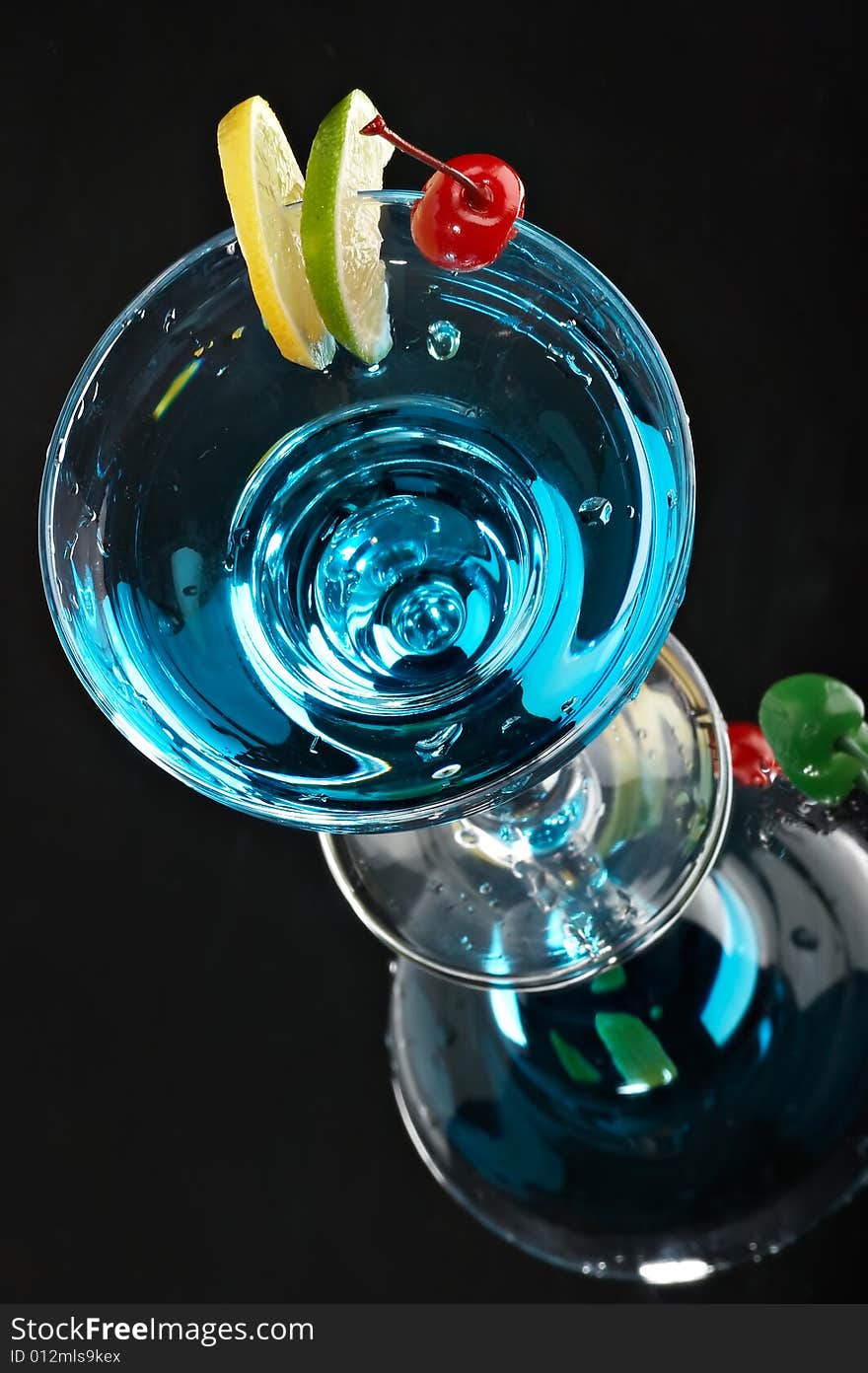 Still life with glass with drink on the black background