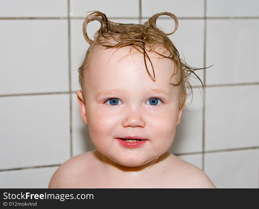 Smiling child in a bathroom. Smiling child in a bathroom