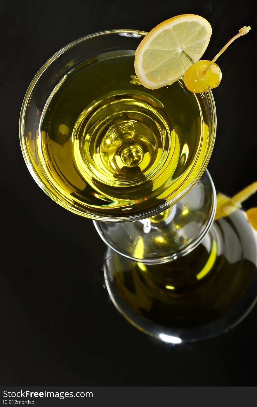 Still life with glass with drink on the black background