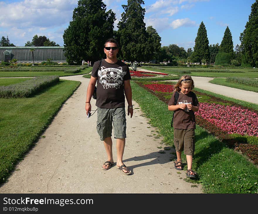 Father and son on the trip in park Lednice in the Czech republic. Father and son on the trip in park Lednice in the Czech republic