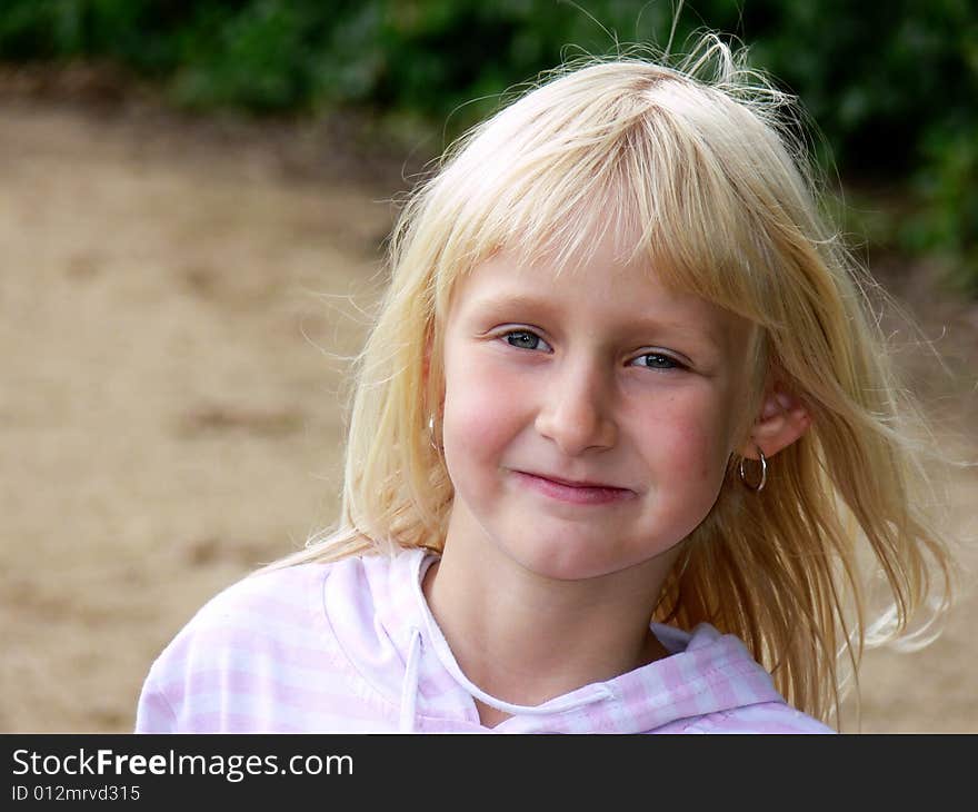 Beautiful little girl with blue eyes and blonde hair. Beautiful little girl with blue eyes and blonde hair.