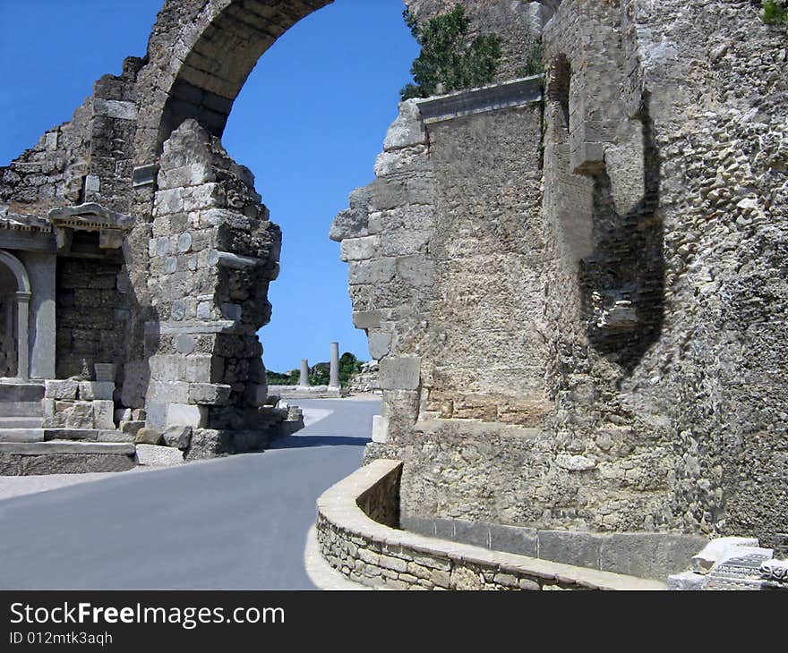 Antique city. Ruins of a gate of leaders in ancient city. Turkey.
Stone gate, ancient constructions, stone strengthenings. Antique city. Ruins of a gate of leaders in ancient city. Turkey.
Stone gate, ancient constructions, stone strengthenings