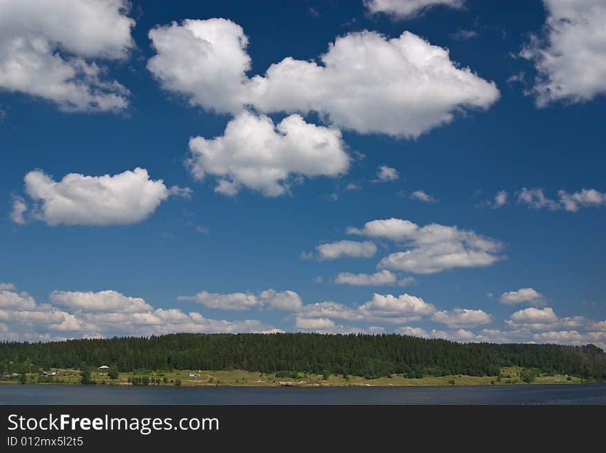 Cloudy river landscape. Photographed from cruise ship.