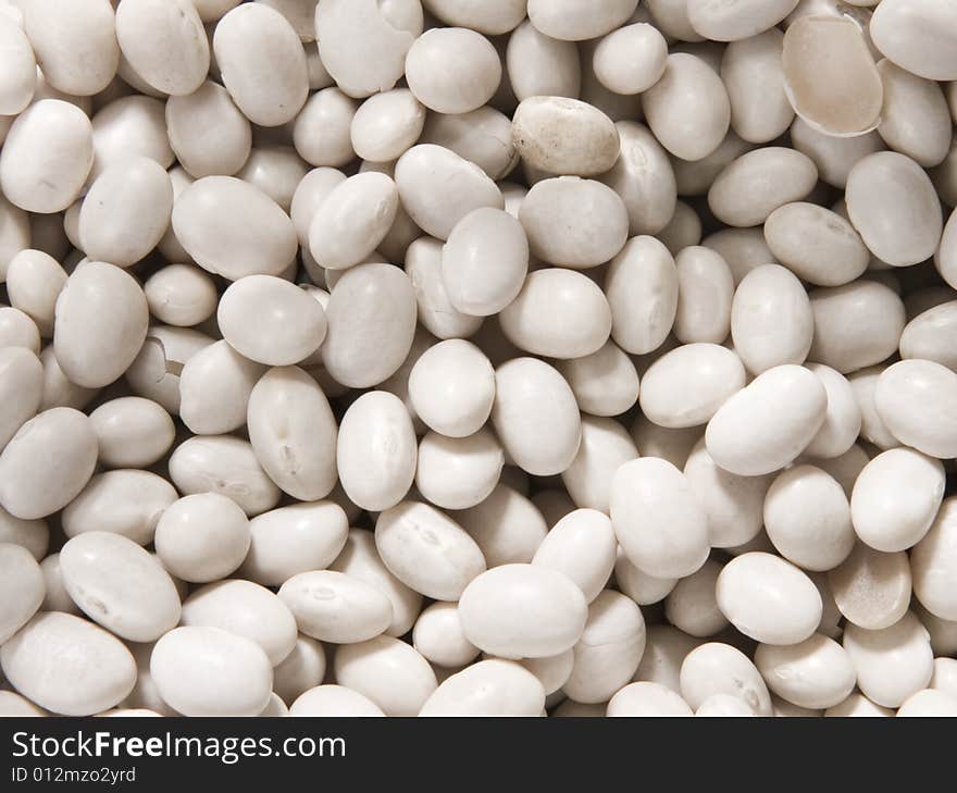 Group of white beans looking like small round stones