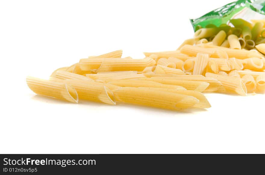 Macaroni garganelli from pack on white ground. Macaroni garganelli from pack on white ground