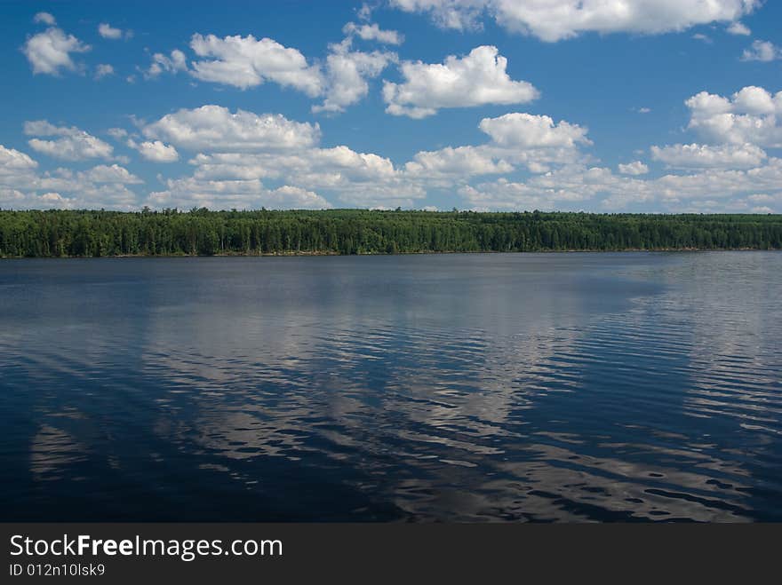 Cloudy river landscape. Photographed from cruise ship.