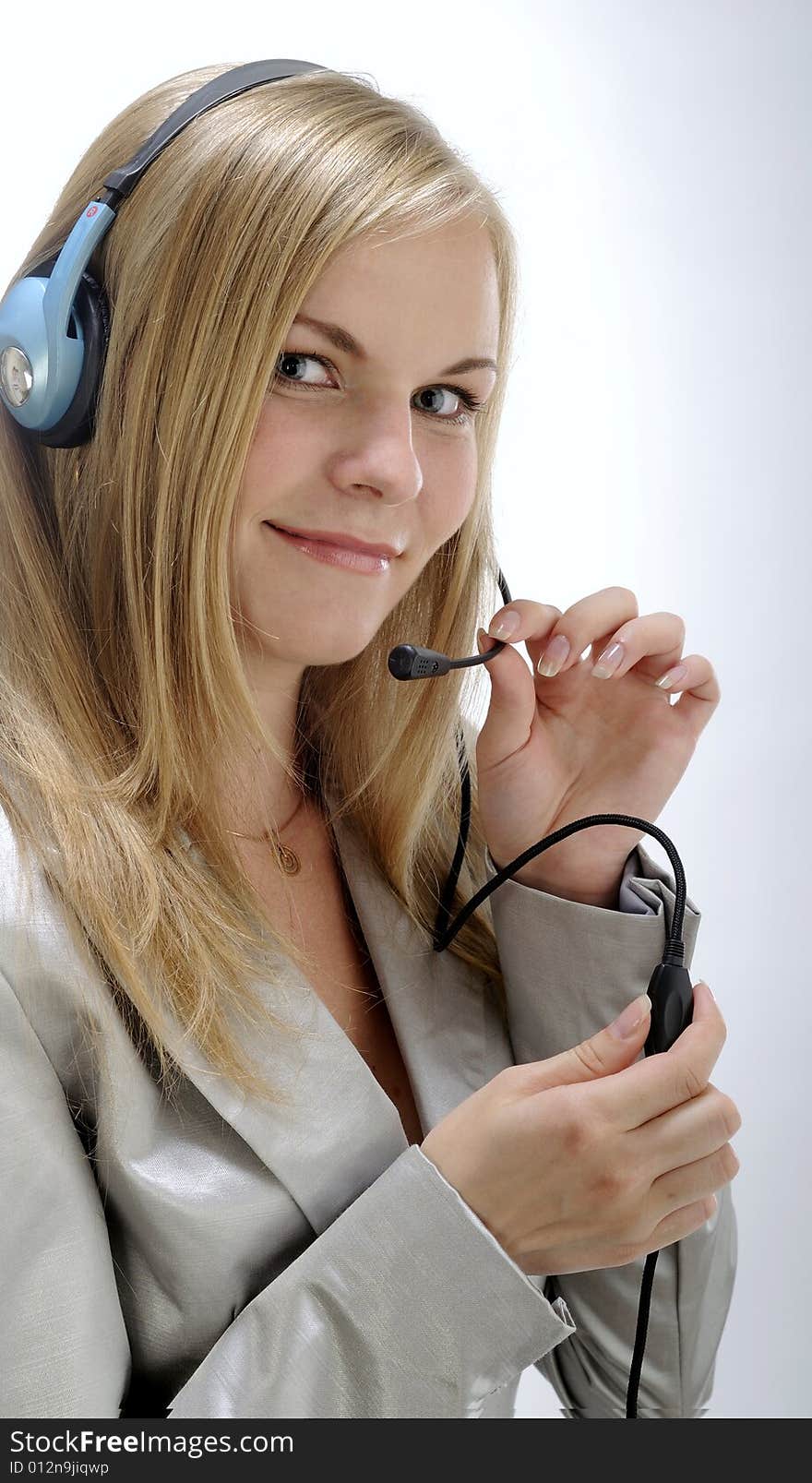 Business woman with headset holds device