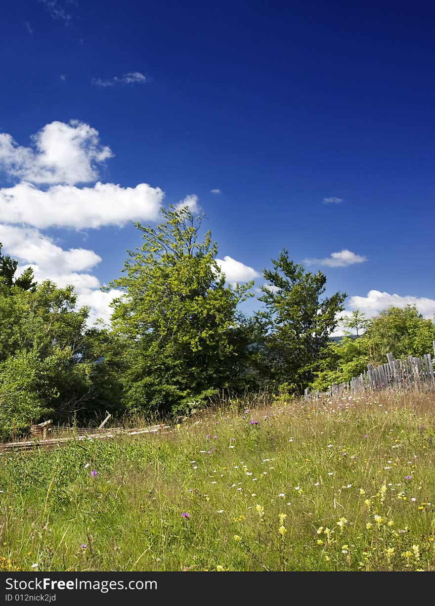 Green hills and beautiful summer sky with clouds