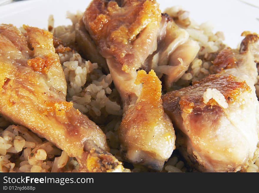 Three fried chicken legs and rice. Three fried chicken legs and rice