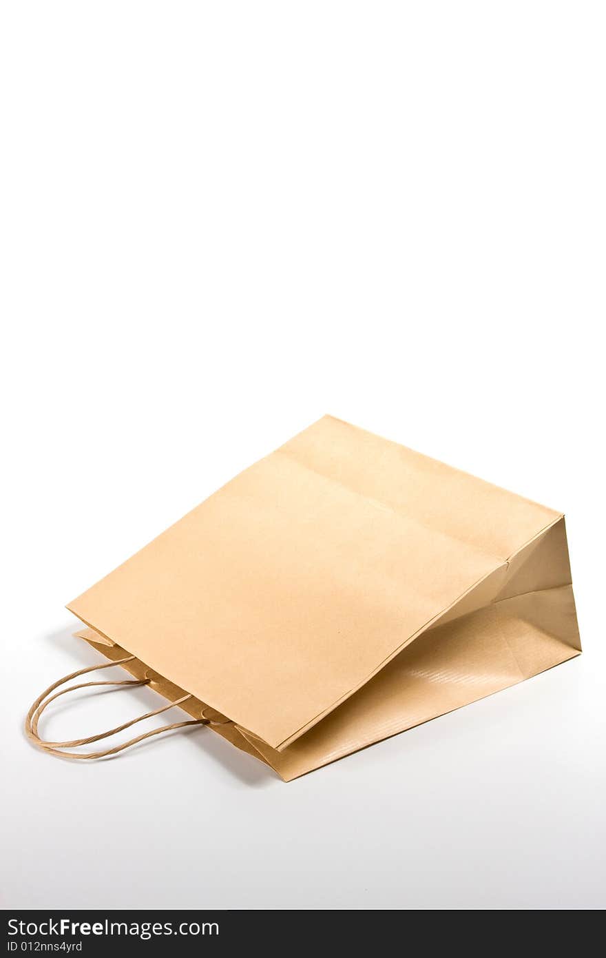 Paper shopping bag on white background.