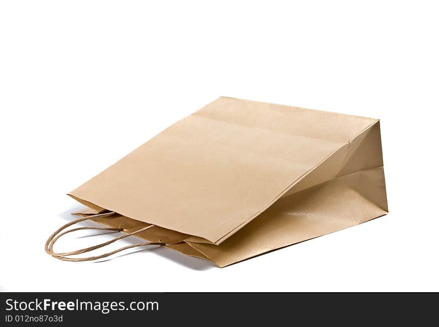 Paper shopping bag on white background.