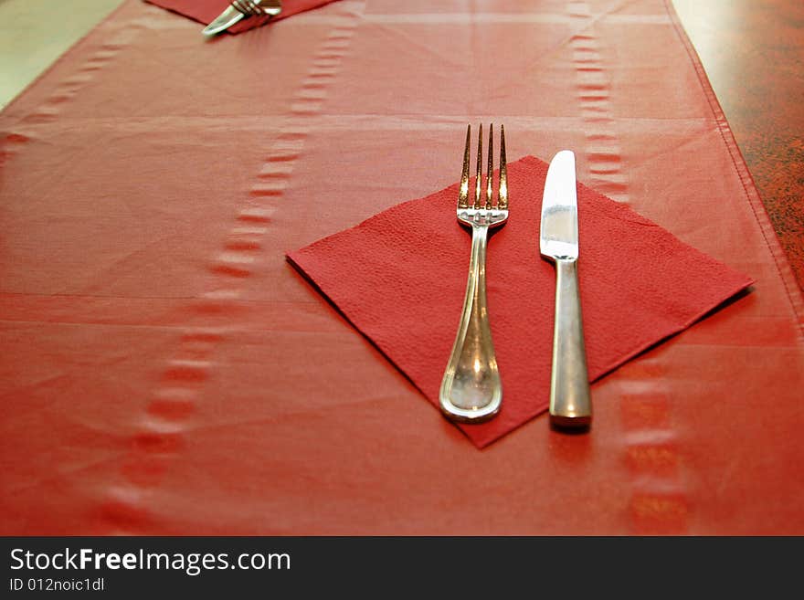 Tableware on red tablecloth in the restaurant. Tableware on red tablecloth in the restaurant