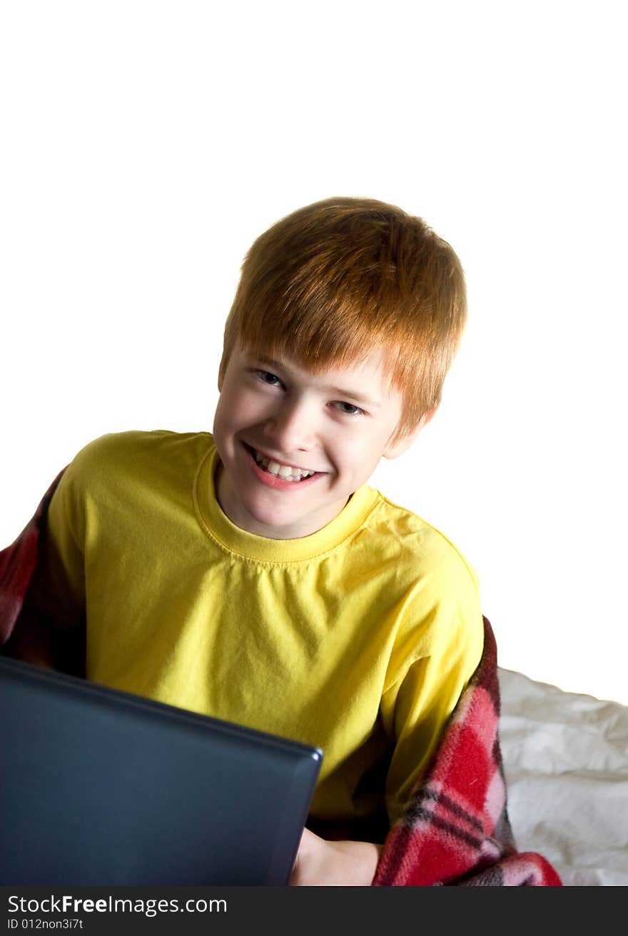 Smiling teenager with a laptop