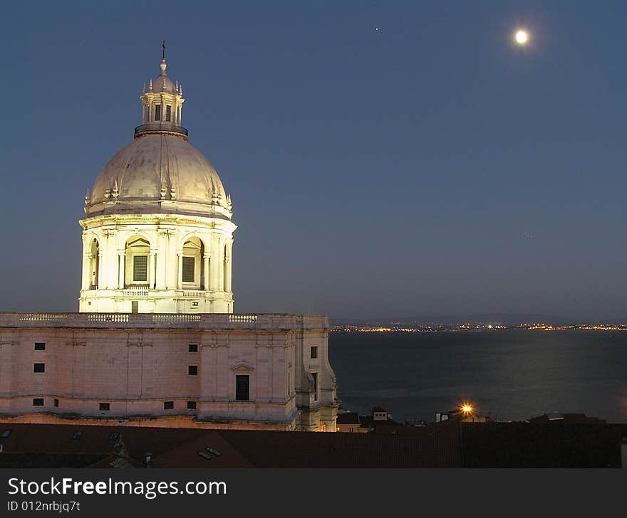 Night view of the National Pantheon, also known as Santa Engracia Church in Alfama, Lisbon with the Tejo river in the background. Night view of the National Pantheon, also known as Santa Engracia Church in Alfama, Lisbon with the Tejo river in the background