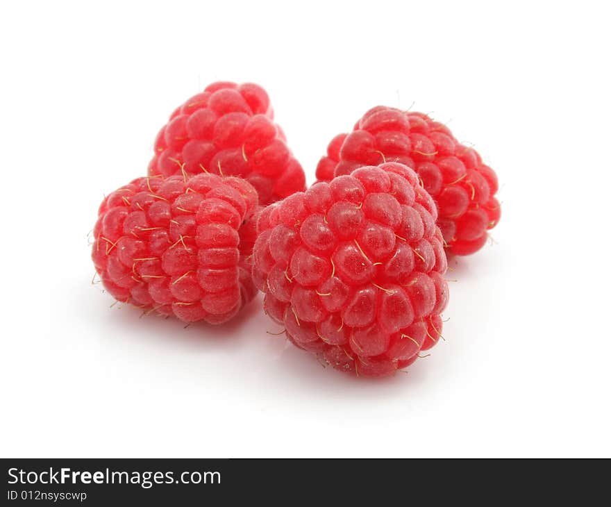 Three raspberry berries isolated