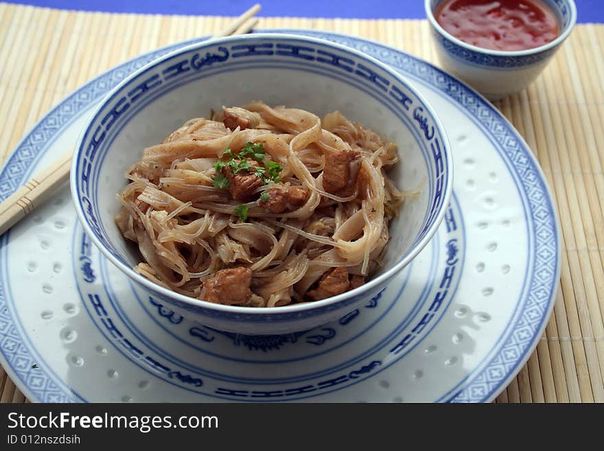 Chinese food with noodles, meat and chilisauce. Chinese food with noodles, meat and chilisauce