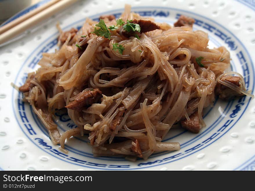 Chinese food with noodles, meat and chilisauce. Chinese food with noodles, meat and chilisauce