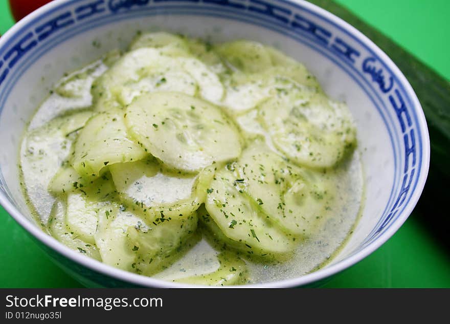 Fresh salad of cucumbers with oil and vinegar