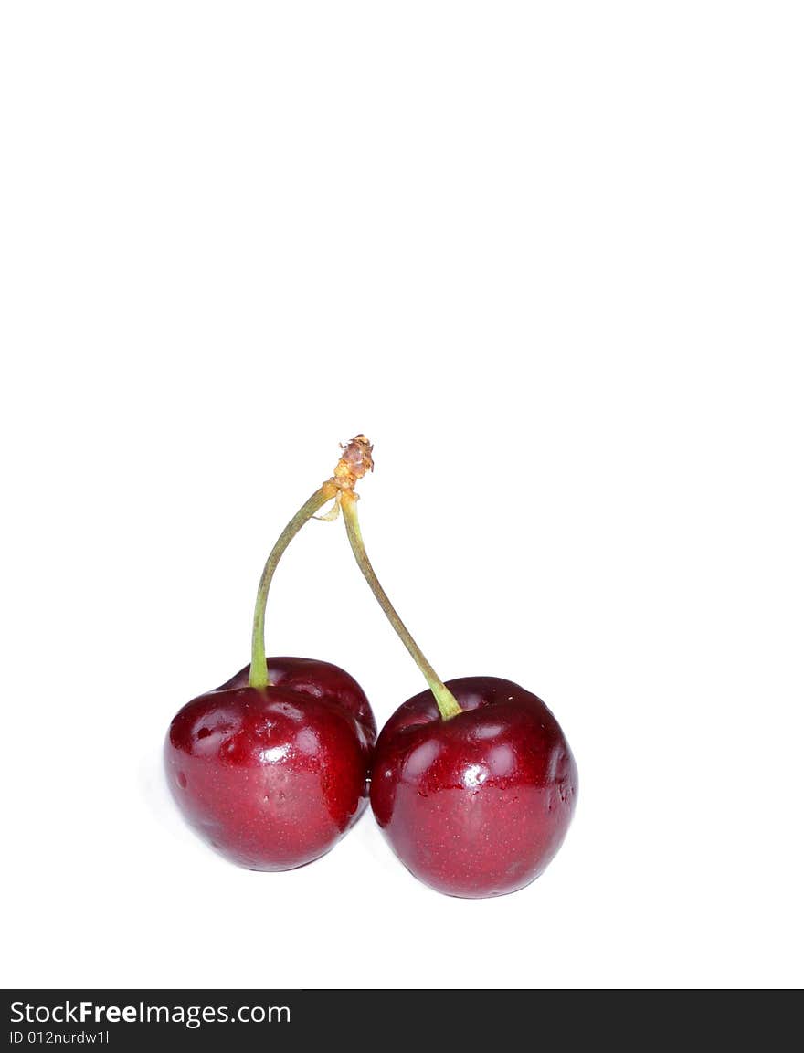 Pair of fresh colorful cherries isolated on white