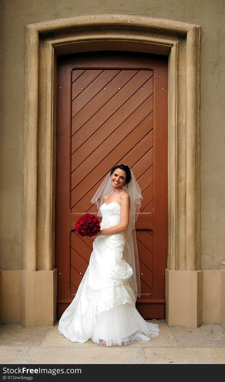 Bride smiling and posing before her wedding