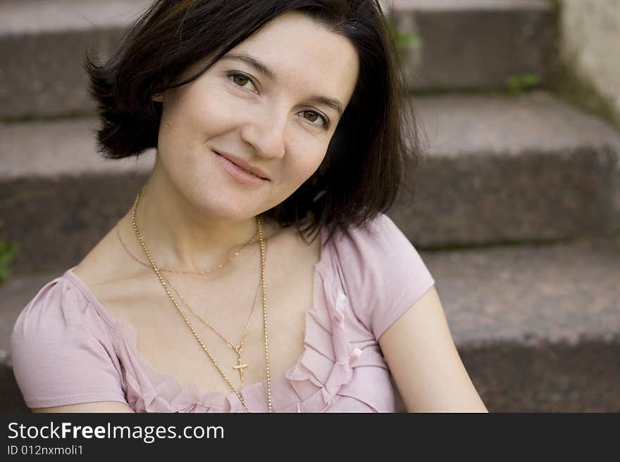 Portrait of attractive smiling brunet woman