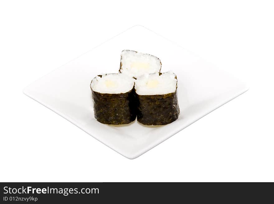 A square white plate with three pieces of sushi