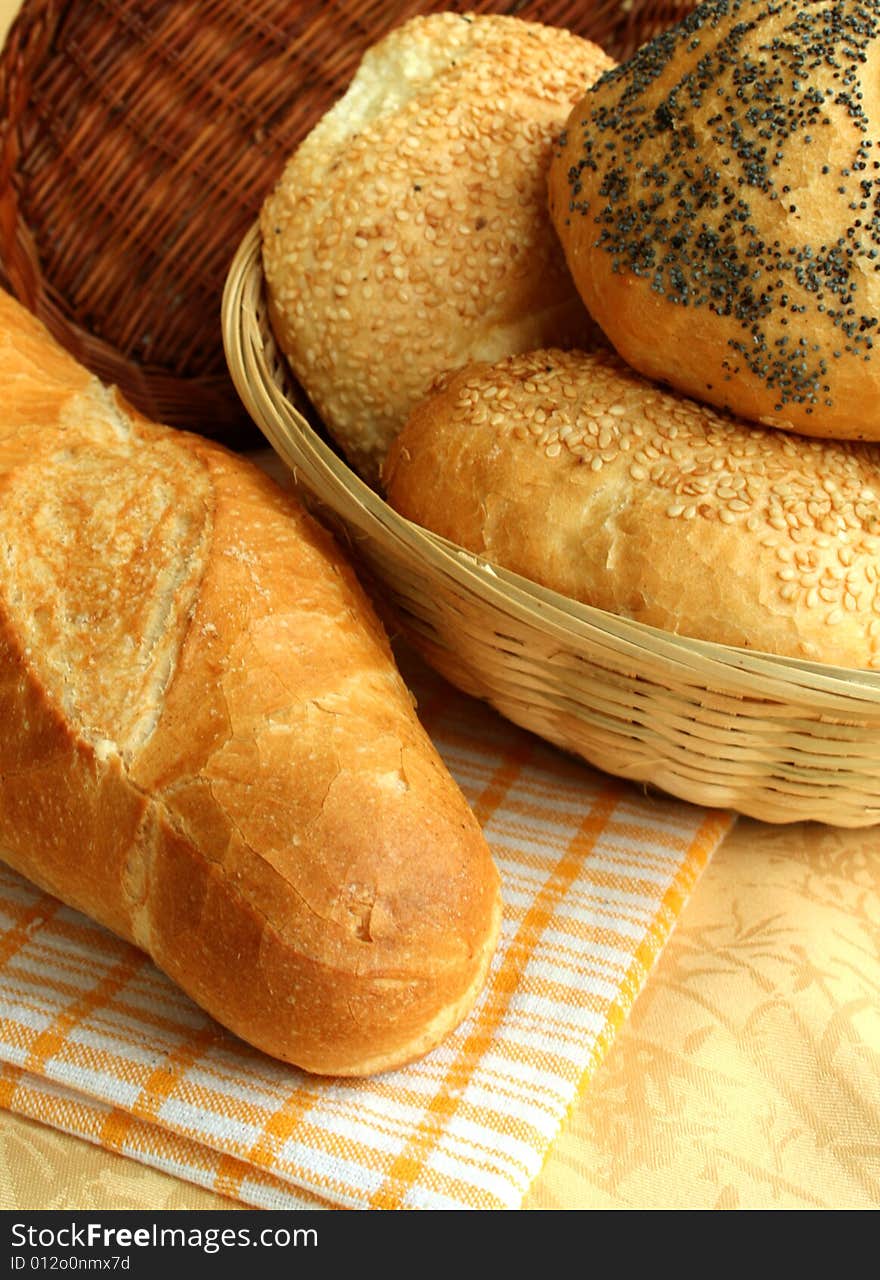 The White Bread With The Poppy On The Checked Tabl