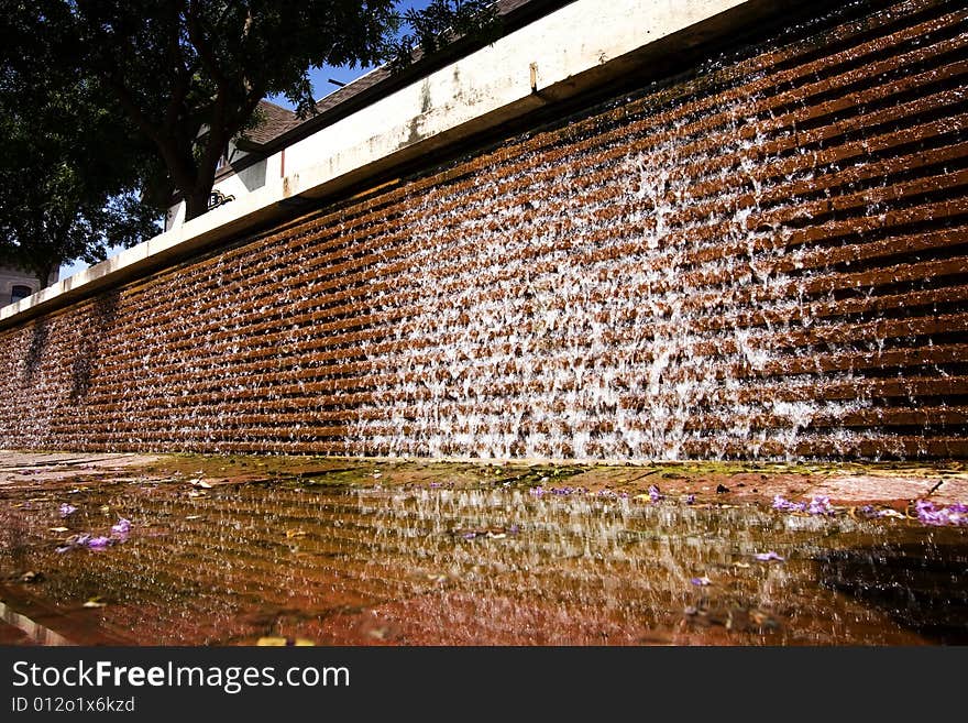 Water cascading down a brick wall. Water cascading down a brick wall.