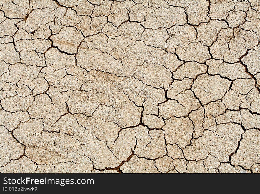 Dried climate, fissured cracked earth and sand. Dried climate, fissured cracked earth and sand
