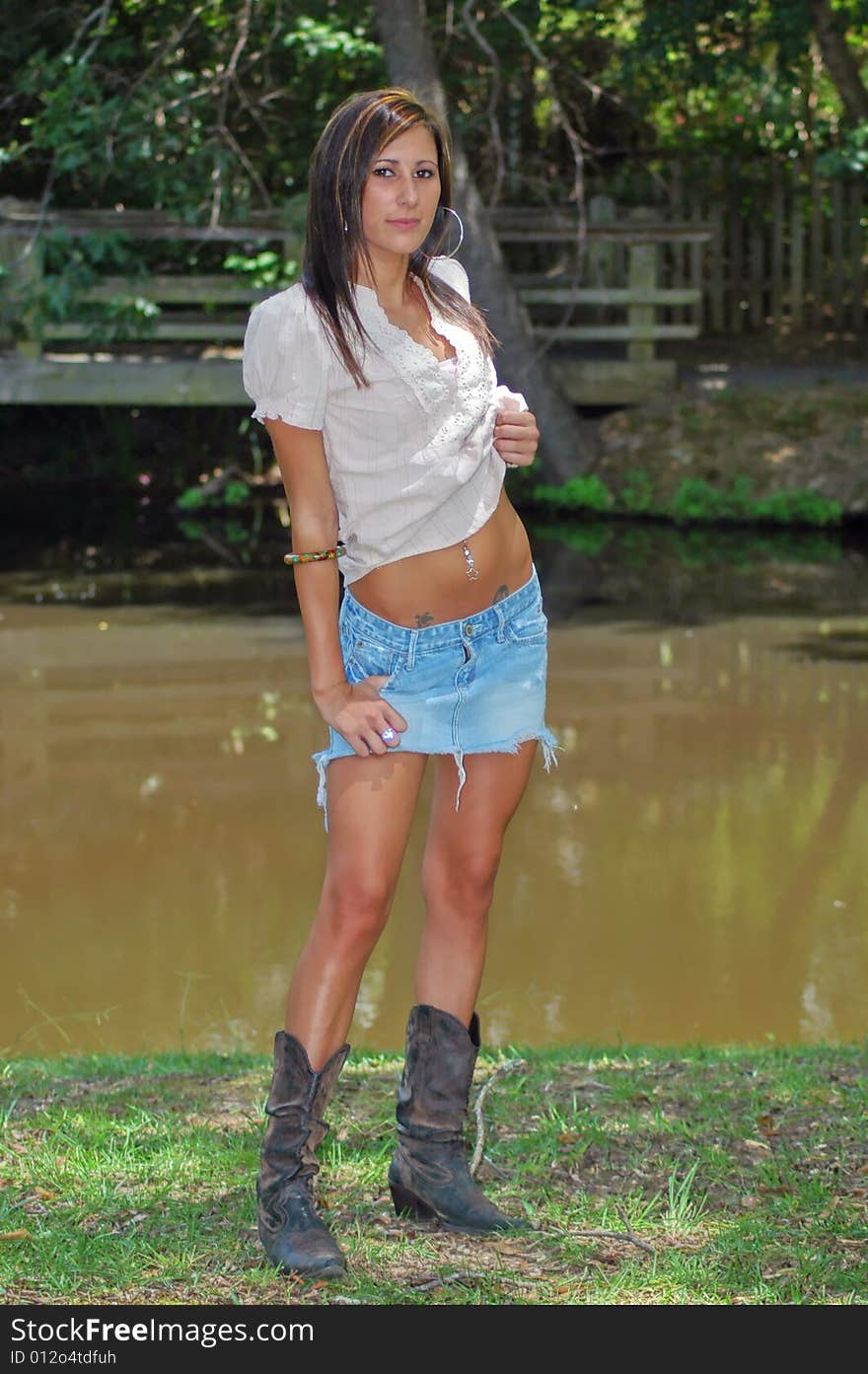 A young lady poses with the lake in the background. A young lady poses with the lake in the background.