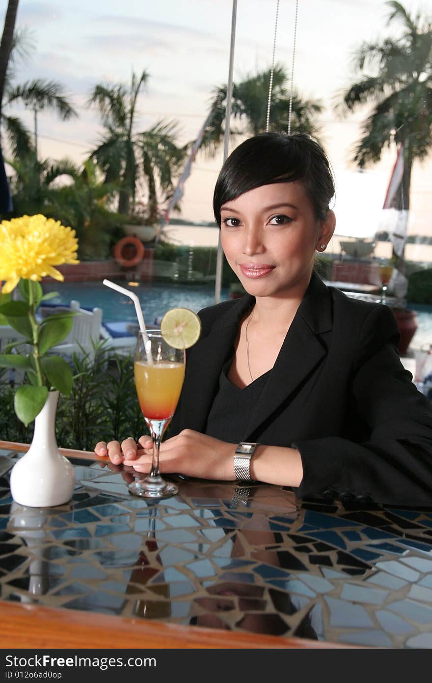 Girl and cocktail at bar