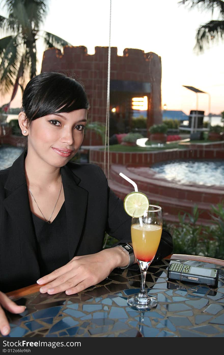 Girl and cocktail at bar