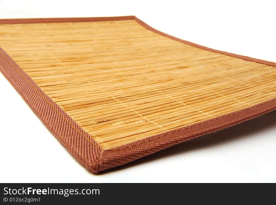 Wooden mat sheathed by the cloth