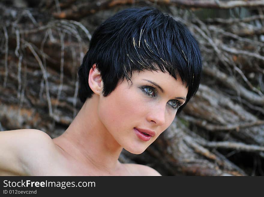 Portrait young beautiful woman in wood