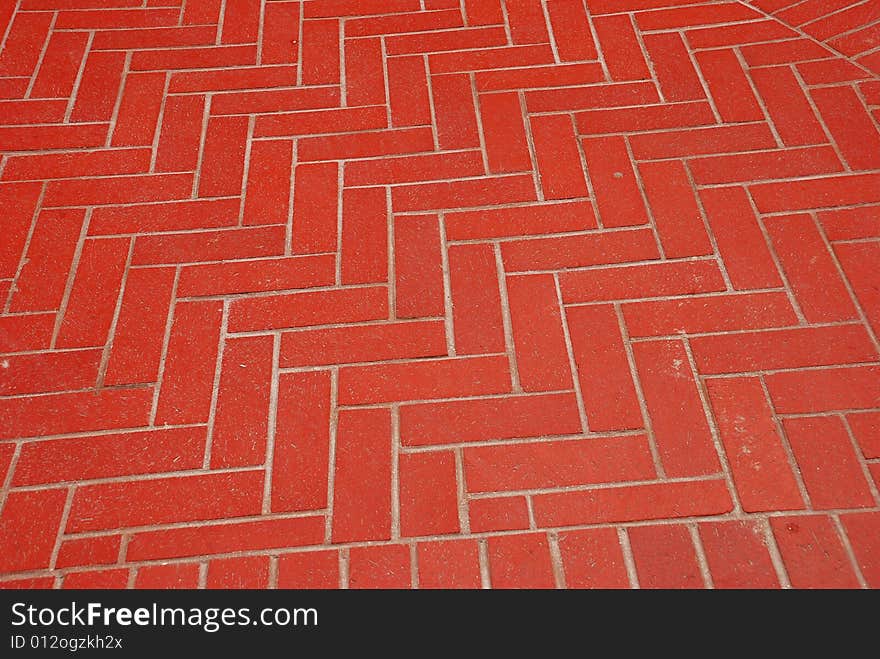 A Herringbone pattern in bricks used to create an outdoor patio