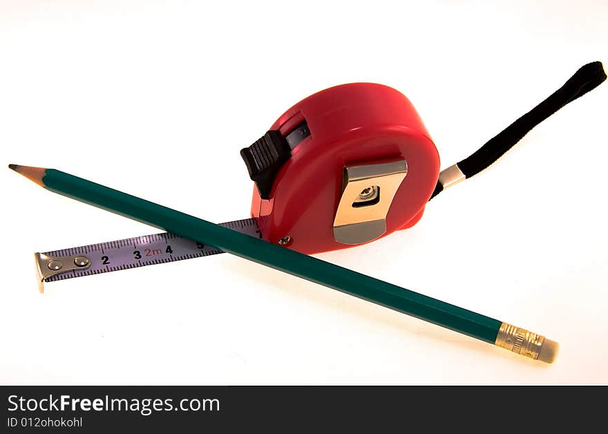 Tape-measure and pencil over white background