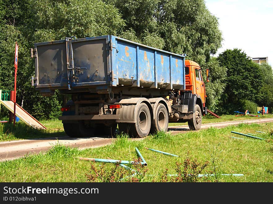 Orange dump track in city park. Orange dump track in city park