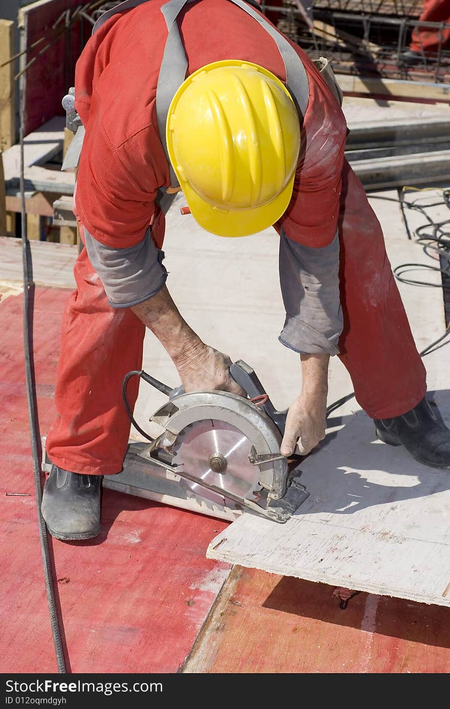 Man Using Skillsaw - Vertical