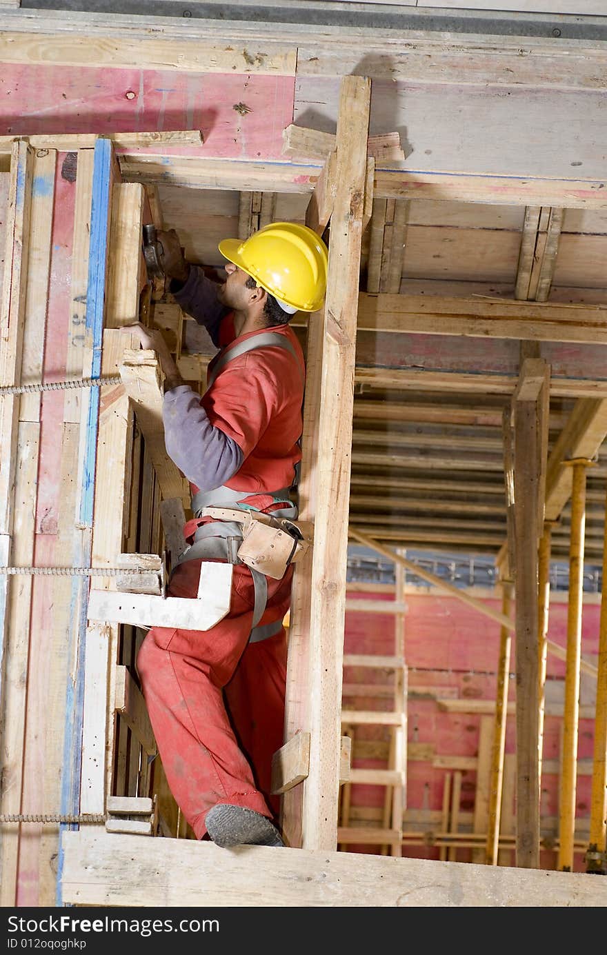 Worker Builds Wall - Vertical