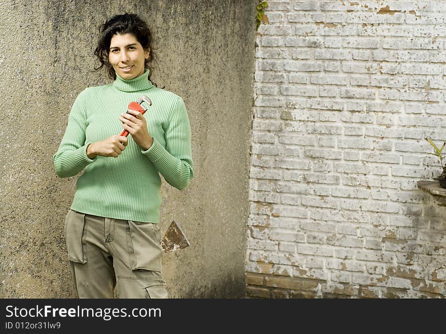 Woman Holding A Wrench - Horizontal