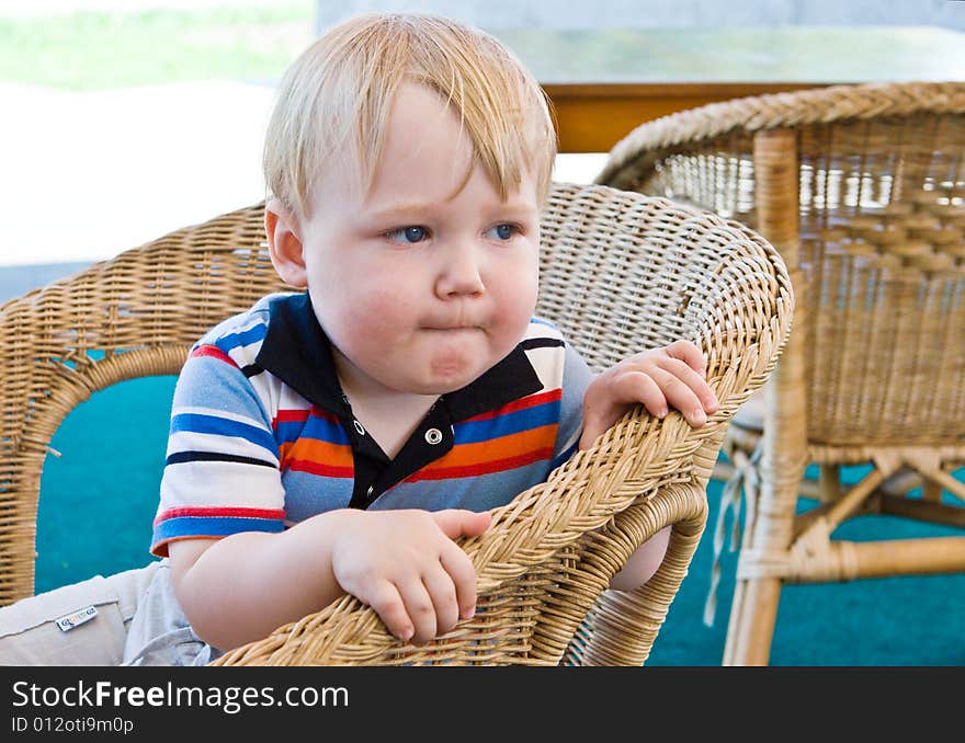 Boy sits on a wum chair. Boy sits on a wum chair