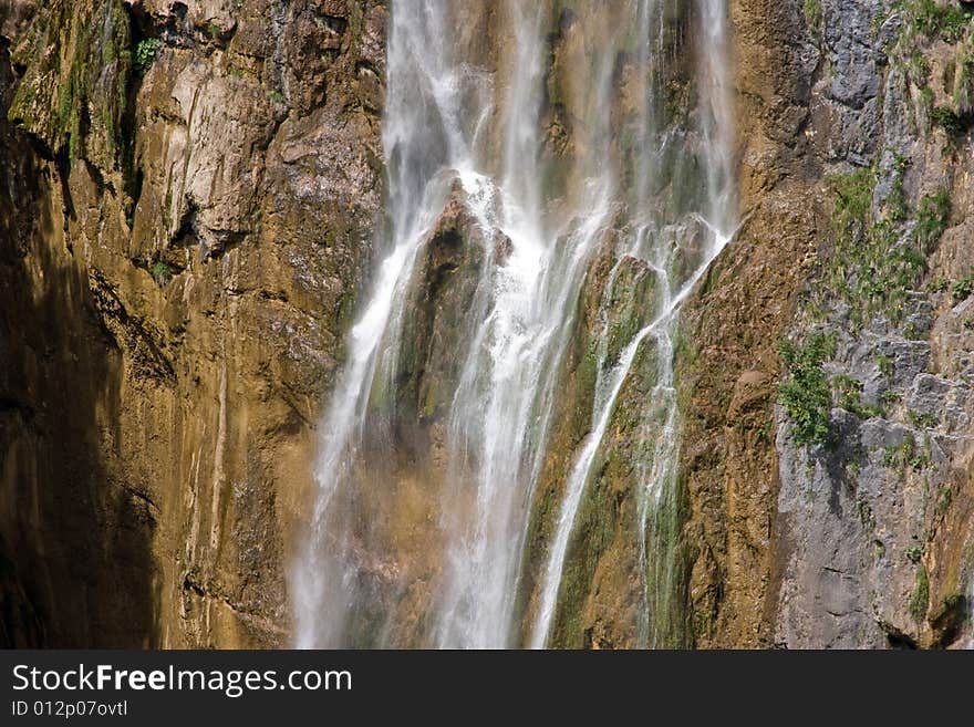 Waterfall with brown and gray rock