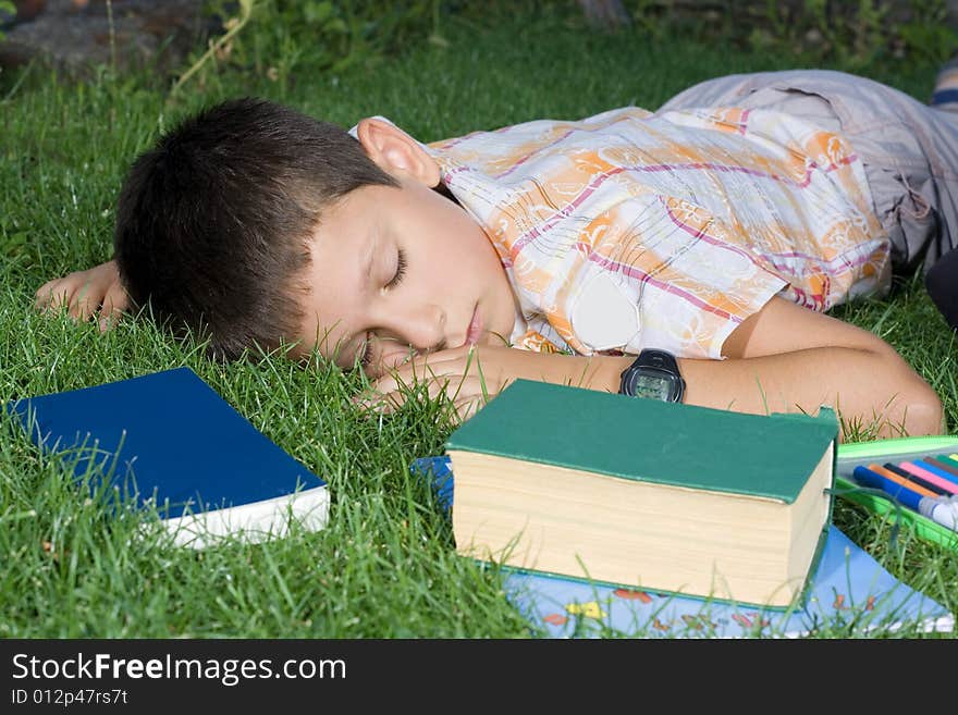 The sleeping student with the books  outdoor