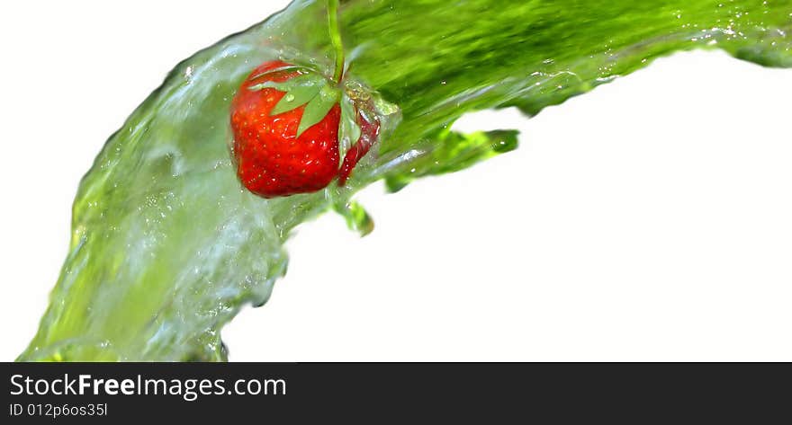 Red color  berry of  strawberry in  stream of water. Red color  berry of  strawberry in  stream of water