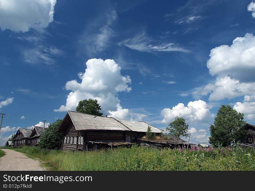 Village. Sky And Clouds