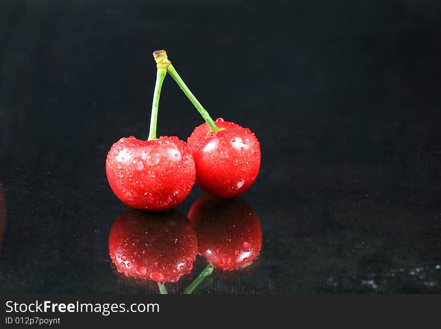 Fresh Cherry with Dew on Dark Glass. Fresh Cherry with Dew on Dark Glass