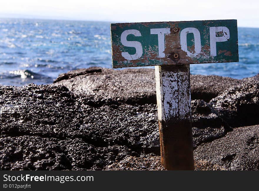 Stop Sign on Cliff Edge