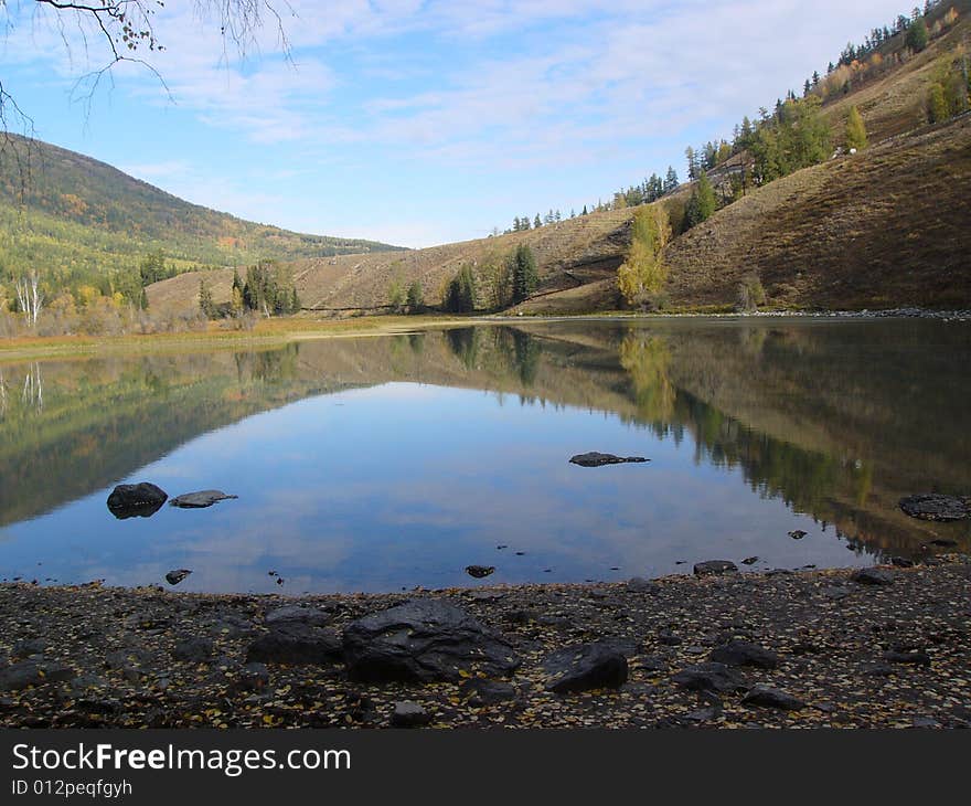 Landscape was mirrored in the lake. Landscape was mirrored in the lake.